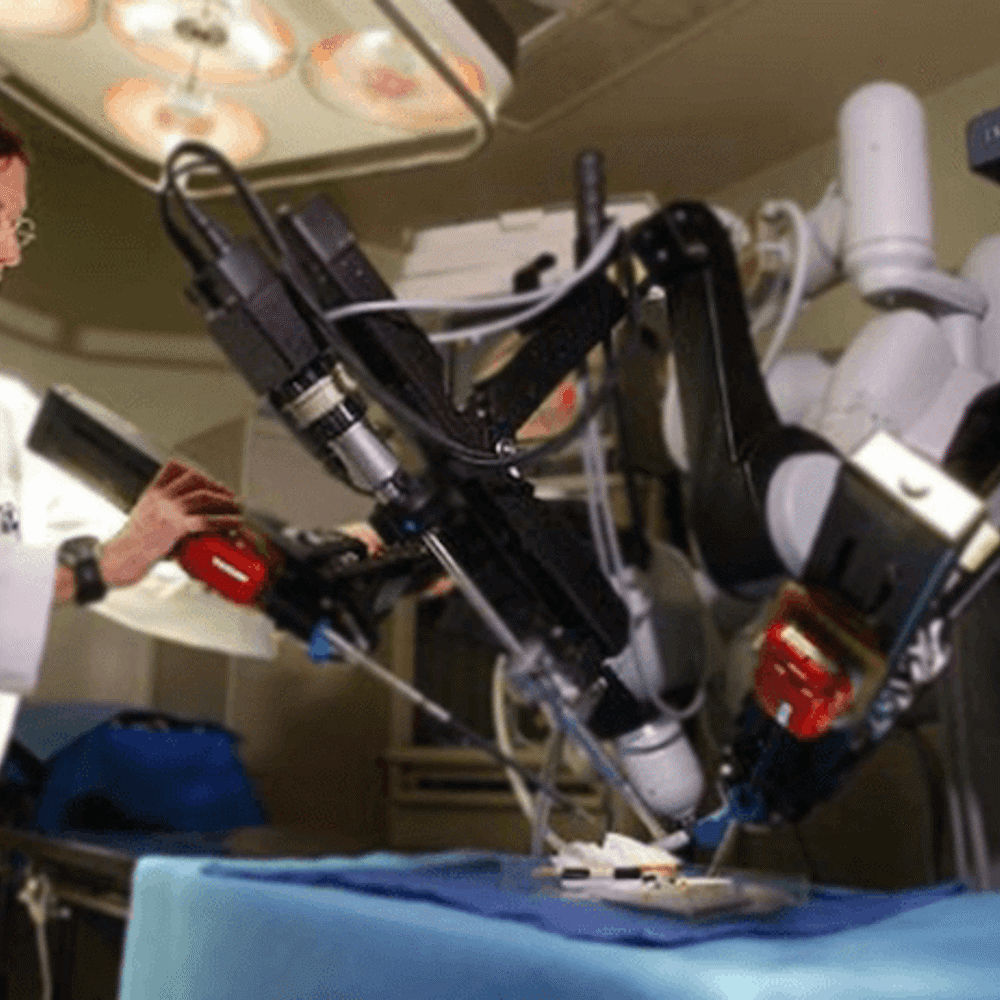 Surgeon working on console from 2000