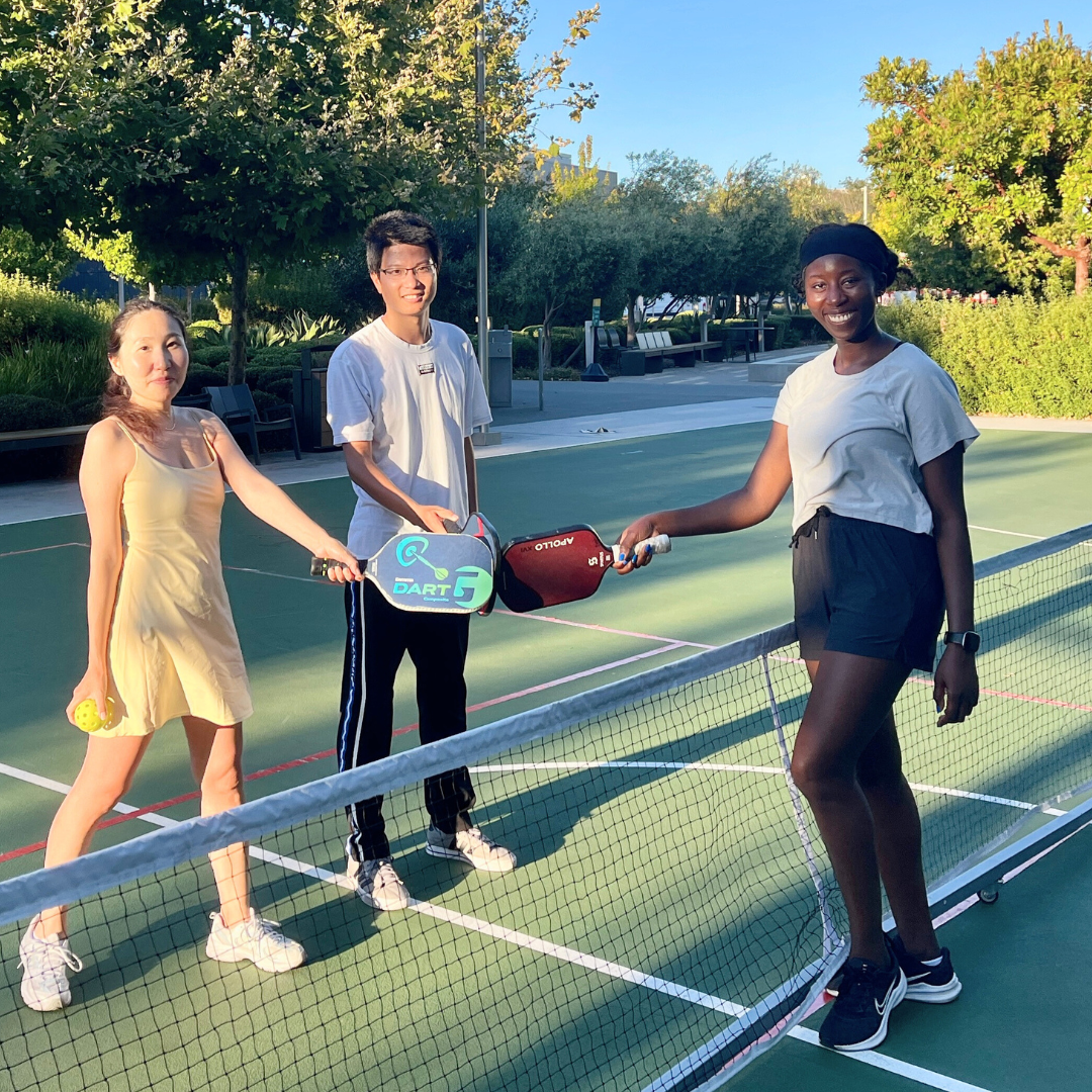 Members of the Systems Analysis team playing pickleball
